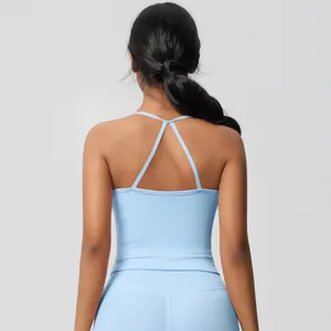 Detail of light blue yoga set featuring a slim-fit V-cross back strap design for women