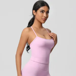 Detail of mauve yoga set featuring high-waist leggings and slim strap sports vest