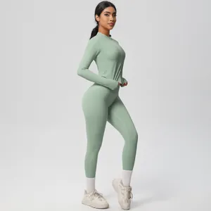 Women mint green yoga set featuring a zip-up long sleeve jacket and high-waist leggings