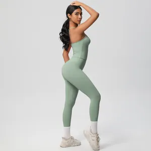 Sage green slim fit yoga set with spaghetti strap tank top and high waist leggings