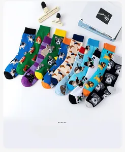 Flat lay of colorful cotton socks featuring diverse animal jacquard patterns and ribbed cuffs