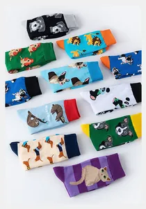Flat lay of colorful cotton socks featuring various cute cartoon animal patterns