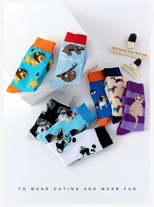 Close-up of vibrant cotton socks featuring colorful cartoon animal patterns and ribbed cuffs