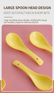 Macro detail of bright yellow long-handle ceramic soup spoon with a hanging hole feature