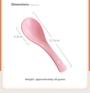 Detail of pink ceramic soup spoon with dimensions and 38g weight on white background