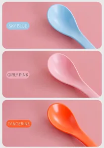 Detailed view of matte ceramic spoons in sky blue, pink and orange candy colors