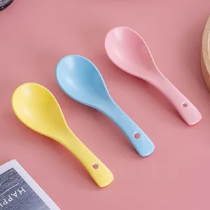 Three-piece set of matte Nordic ceramic spoons in pink, blue, and yellow with hanging holes