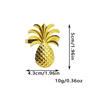 Detailed view of a gold pineapple napkin ring showing dimensions of 5cm by 4.3cm