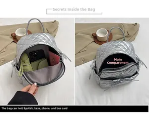 Silver quilted mini backpack detail showing interior storage for umbrella and phone
