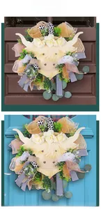 Detail of Highland Cow wreath with faux yellow flowers and patterned decorative ribbons