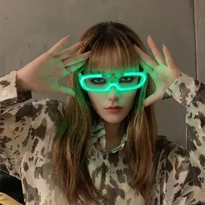Close-up of LED glowing glasses with green neon light pipes worn at a party event