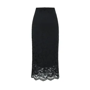 Detailed view of the intricate floral lace texture and scalloped hem of this black pencil skirt