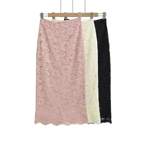 Detailed close-up of intricate lace textures and scalloped hems on high-waist skirts