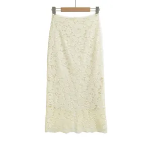 Close-up of elegant ivory floral lace fabric with delicate scalloped hemline detail