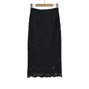 Detailed close-up of high-waisted black lace skirt featuring elegant scalloped floral hemline