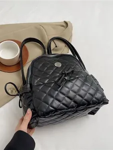 Classic black quilted backpack with top handle and drawstring closure for women