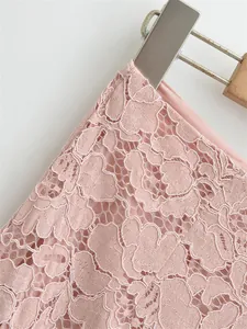 Detail of pink floral lace fabric with smooth inner lining on a high-waisted skirt
