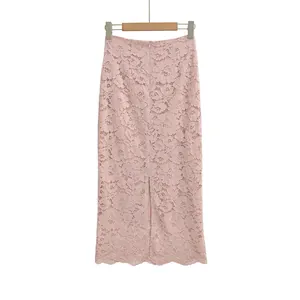 Detail of pink floral lace fabric and rear slit design on a high-waisted midi skirt