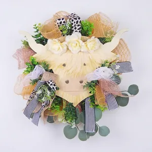 Highland cow wreath with white flowers and checkered ribbons for home spring door decor
