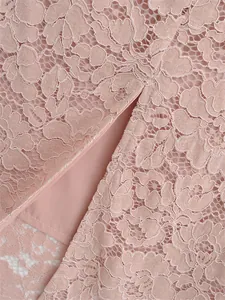 Macro view of pink floral lace fabric detailing with back slit and smooth inner lining