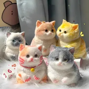 Group of soft realistic squishy cat toys with fluffy fur texture and cute bell collars