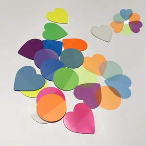 Macro detail of colorful translucent round and heart sticky index tabs with layering effect
