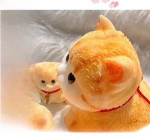 Detail of orange tabby cat stress relief toy with red collar and metallic tag