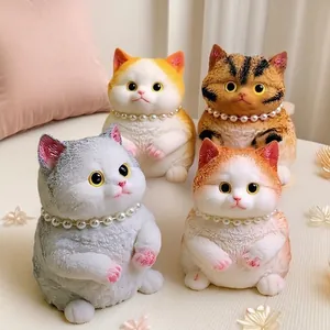 Four different colorful cat squishy toys with pearl necklaces for stress relief and fun