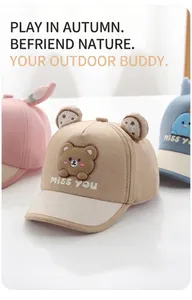 Detail of baby sun caps with soft ears, cartoon bear patch and miss you embroidery