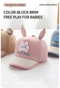 Detail of pink baby sun hat featuring 3D rabbit ears and MISS YOU printed brim