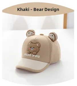 Close-up of khaki baby sun hat featuring a cute 3D bear patch and white miss you embroidery