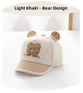 Detail of baby bear baseball cap with 3D ears and Miss You embroidery in beige and khaki