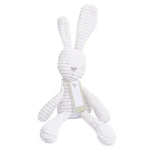 Detail shot of plush bunny face with embroidery and white corduroy texture