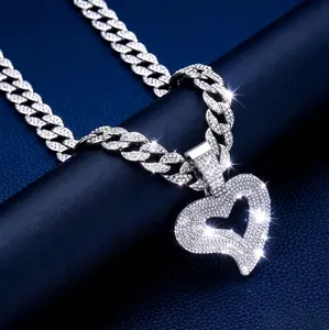 Iced out hip hop Cuban link necklace with large pavé-set heart pendant in silver finish