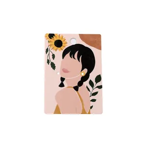 Pink jewelry display card featuring elegant sunflower illustration for earrings