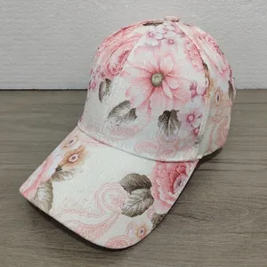 Detail of pink floral paisley pattern on a breathable cotton women's sun hat visor