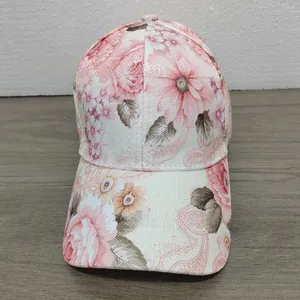 Detail view of pink floral pattern on cotton-linen sun hat with rose and daisy prints