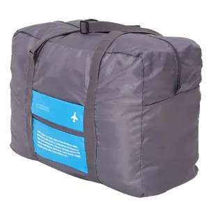Large gray foldable travel duffel bag with a blue front pocket and airplane design