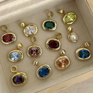 Oval birthstone charm collection with 12 colored zircons and gold-plated frames