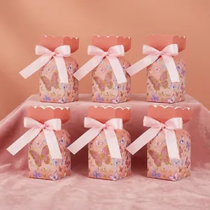 Detail view of 6 pink butterfly gift boxes with ribbons and gold Thank You lettering