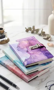 Detail of marble pattern password journals with silver metal locks and premium inner pages