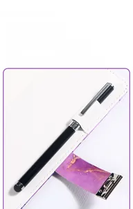 Detail of purple marble lockable notebook showing internal pen holder and silver clip pen