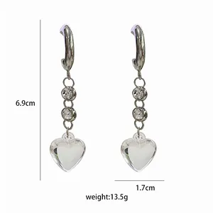 Detail view of long tassel earrings with dimensions showing 6.9cm length and crystal accents