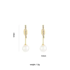 Detail view of long tassel earrings with white pearls and sparkling studs, 2.8cm length