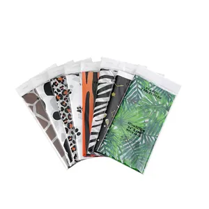 Detail of multi-pattern animal print PEVA tablecloths in individual 137x274cm packaging
