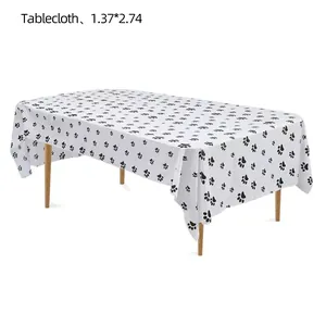 Detail of disposable PEVA tablecloth with black paw print pattern, 1.37x2.74m