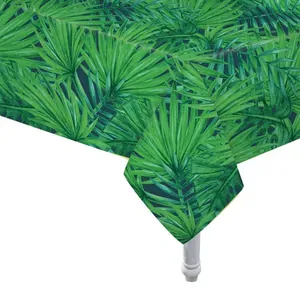 Close-up of waterproof PEVA tablecloth with tropical green palm leaf pattern