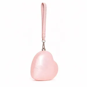 Pink heart-shaped acrylic evening clutch with pearl finish and leather wrist strap