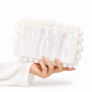 Elegant white marble acrylic evening clutch bag with pearl accents for wedding and gala