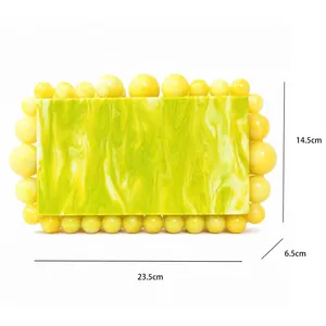 Detail view of marble acrylic clutch with dimensions 23.5cm x 14.5cm x 6.5cm